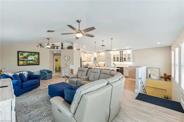 Living room from front corner showing entry stairs.