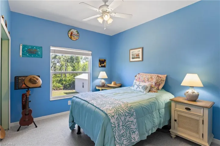 Guest bedroom # 2 with beautiful views to the rear of the property and the endless pinetrees and gorgeous views!