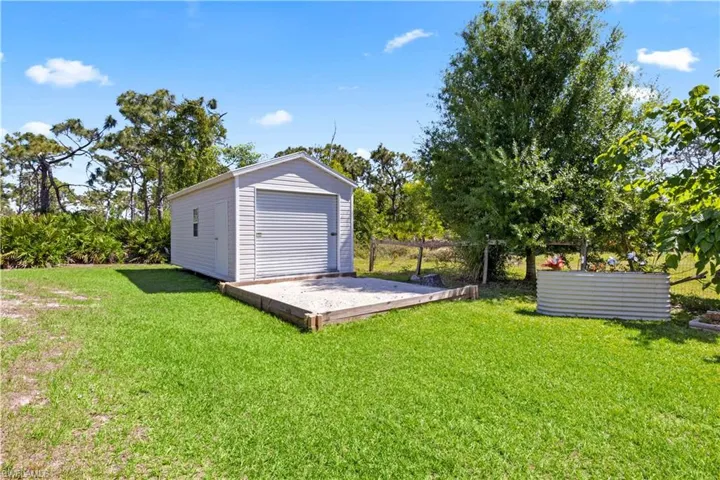 The property has so many fun features incuding this detached metal building that can be used for a variety of purposes - storage, garage conversion, potting room and so much more!