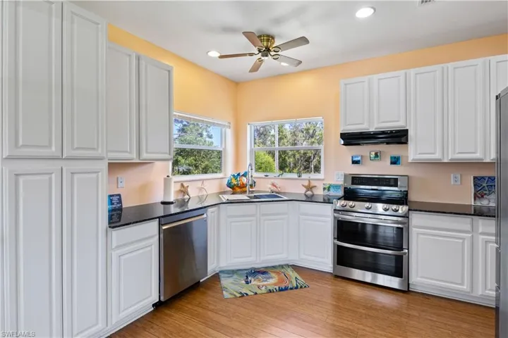 The kitchen is wrapped around the back corners and is both functional and fun.  Lots of counter space and even more storage!