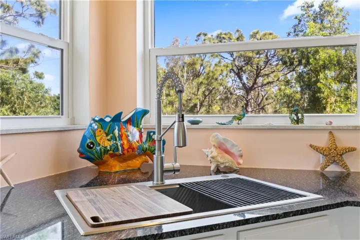 Who knew washing dishes could be so enjoyable with these veiws!  Updated sink and faucets as well - truly nothing to do!