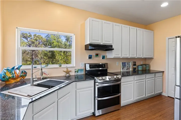 Updated and remodeled kitchen with stainless steel appliances, granite countertops, TONS of storage and more of those beautiful views!