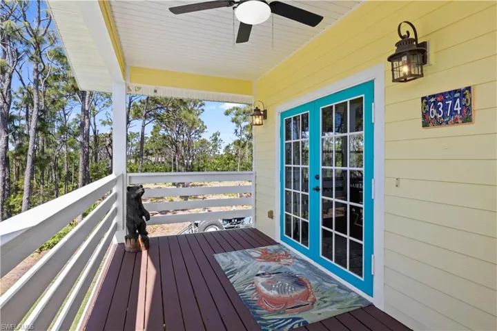 Charming Key West muted colors create a gorgeous palette - a very wide balcony with double french entry doors and the perfect place to kick back and watch the eagles, birds, peacocks and other natural wildlife!
