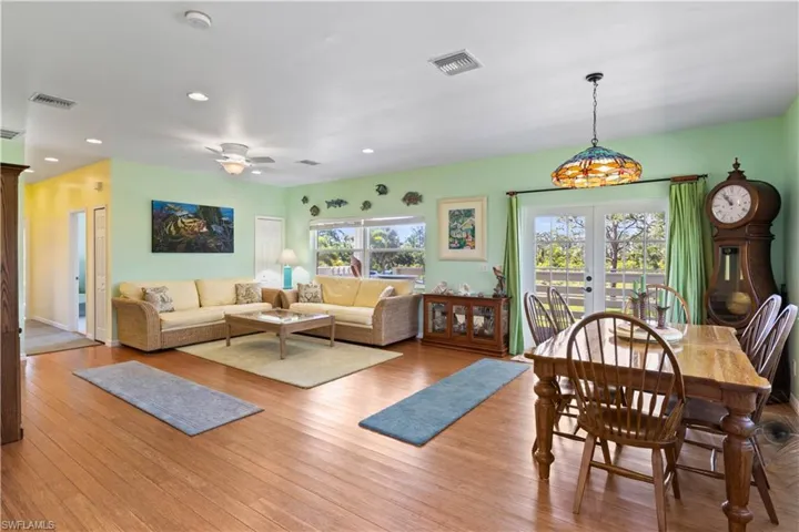 View of the great room and the dining area as well as the front porch balcony.