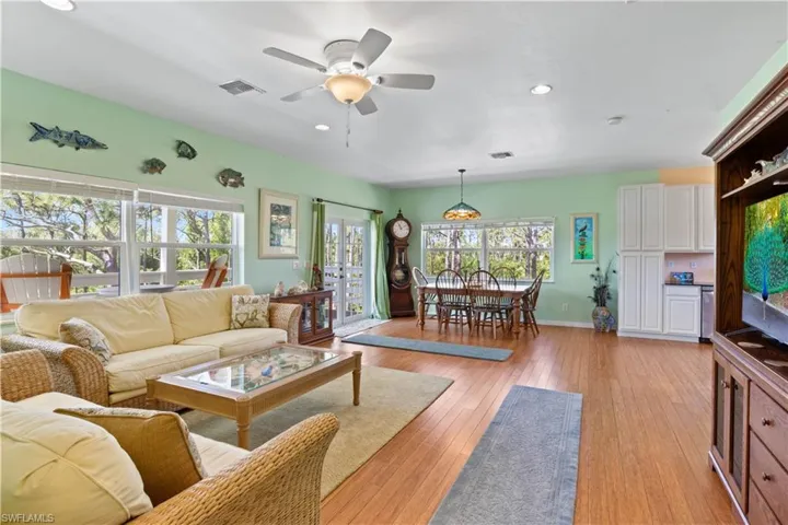 Looking from the great room to the dining area and kitchen - a true open layout with a very flexible floorplan!  The home is meticulous and pride of ownership is apparent in every way!
