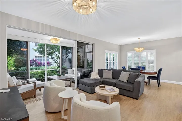 Living room featuring a chandelier and light wood-style floors