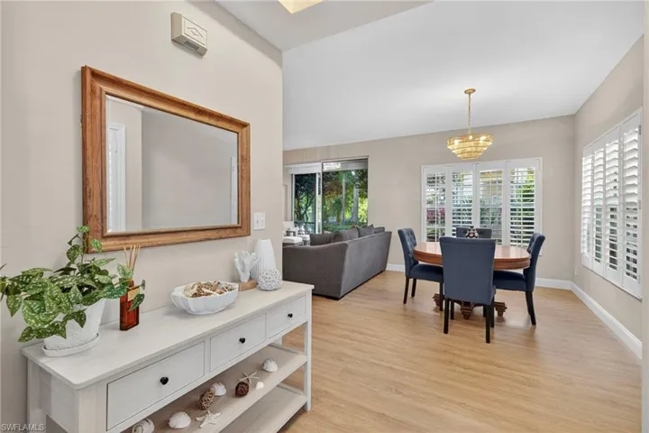 Dining space featuring light wood-style floors and a chandelier