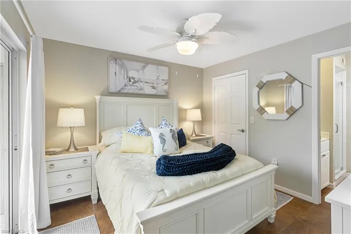 Bedroom featuring a ceiling fan and baseboards