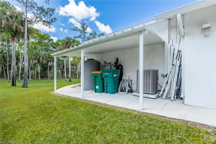 View of patio featuring central AC and Kinetico water system.