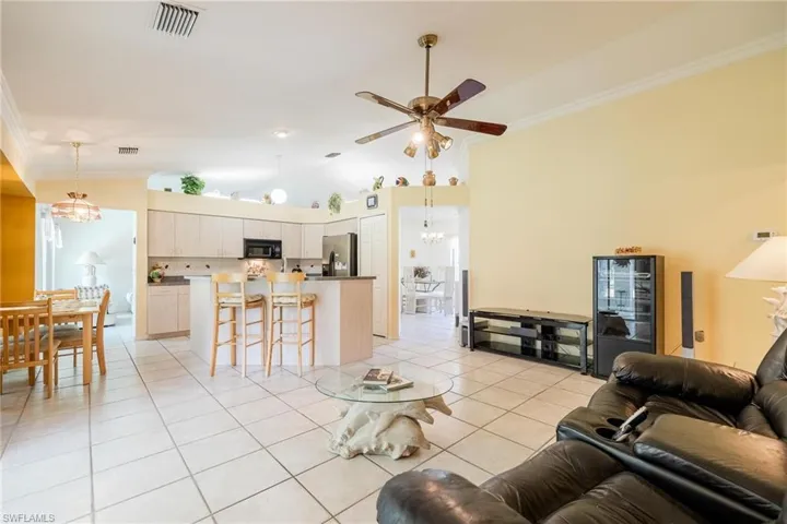 Family room with open floor to the kitchen and vaulted ceilings.