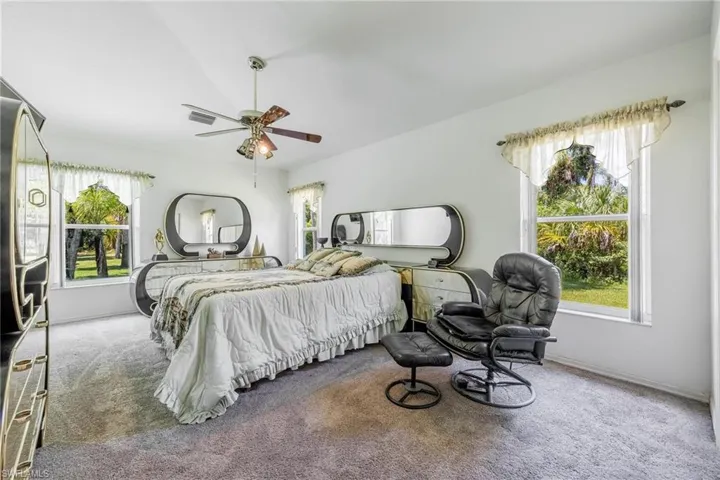 Large master bedroom with walk-in closet and plenty of windows for natural light and beautiful views.