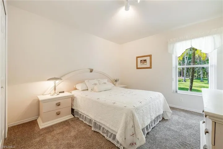 Guest bedroom with carpet flooring