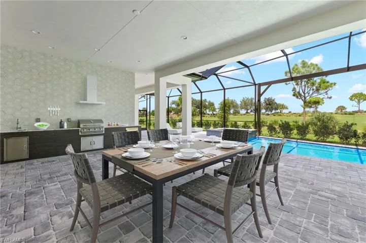 View of patio / terrace featuring glass enclosure, area for grilling, grilling area, and sink