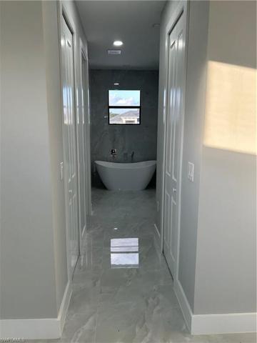 Master bedroom view of bathroom and closets
