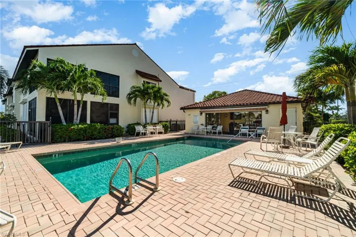 Community pool with a patio area