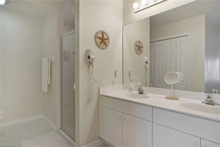 Dble sinks in Primary Bathroom, Separate spacous Shower with glass door
