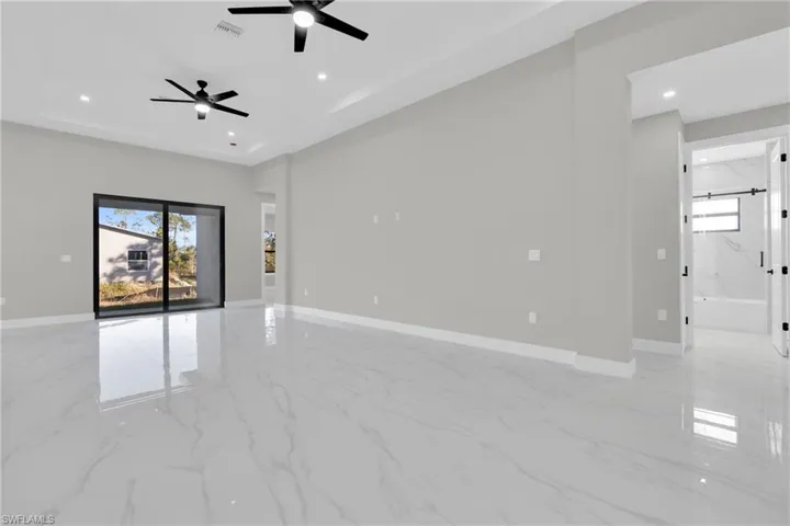 Spare room featuring light marble finish flooring, recessed lighting, and ceiling fan