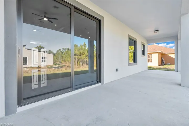 View of patio featuring ceiling fan