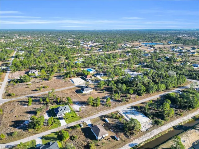Aerial overview of property's location with nearby suburban area