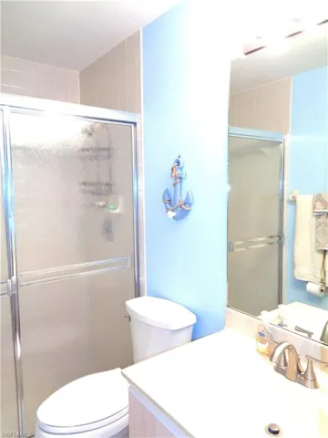 Full bathroom featuring vanity and a stall shower