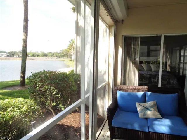 Sunroom / solarium with a water view