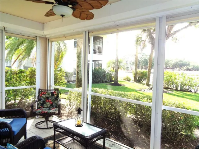 Sunroom / solarium with ceiling fan and healthy amount of natural light