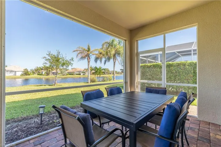 Sunroom with plenty of natural light and a water view