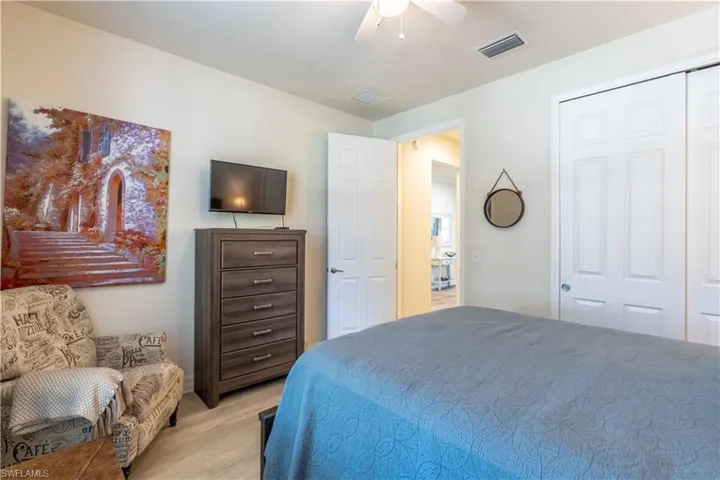 Bedroom featuring a closet, ceiling fan, and light hardwood / wood-style floors