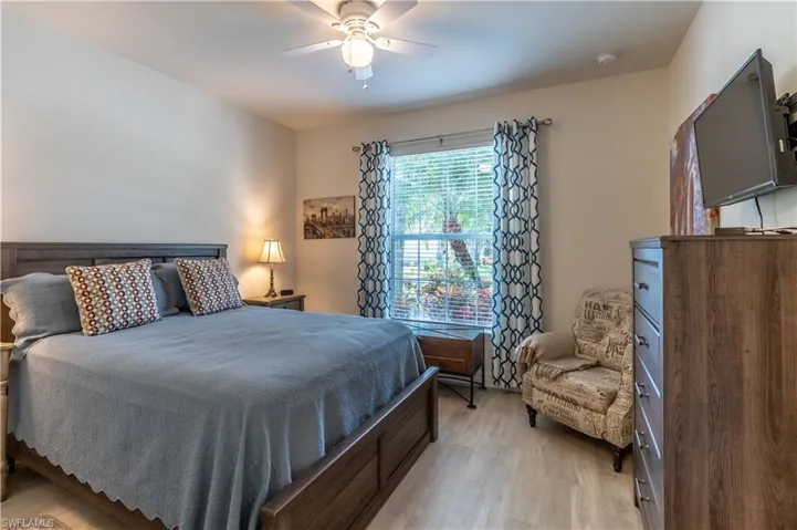 Bedroom featuring light wood-type flooring and ceiling fan