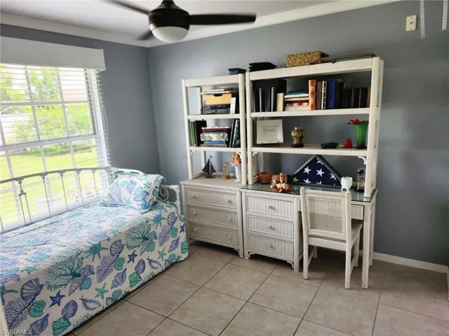 Secondary Bedroom featuring light tile patterned flooring,  and ceiling fan
