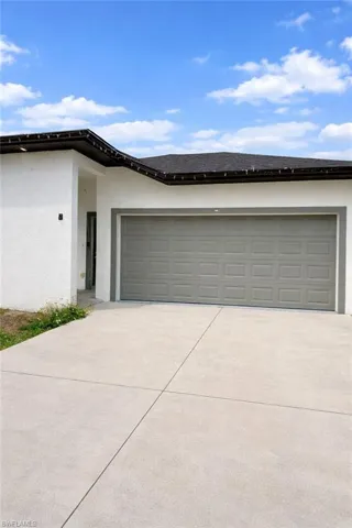 Garage with concrete driveway