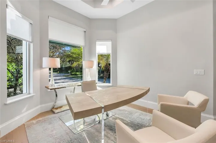 Home office featuring baseboards and wood finished floors