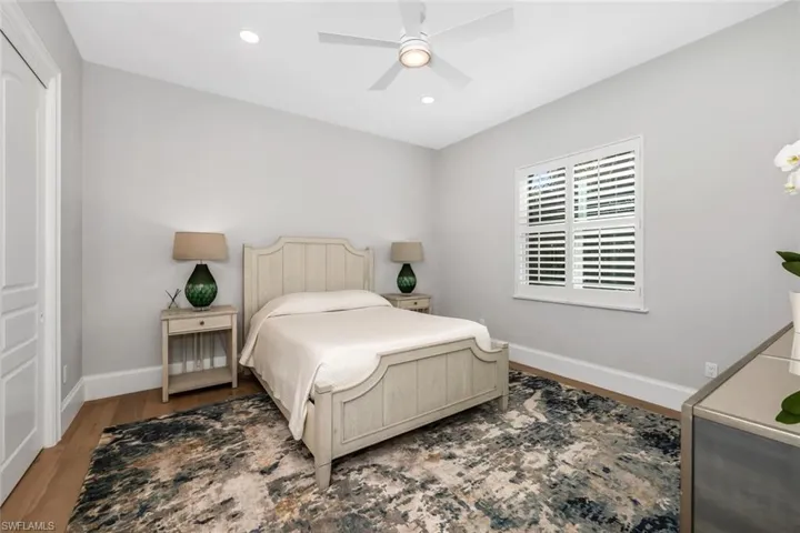 Bedroom featuring recessed lighting, wood finished floors, and a ceiling fan