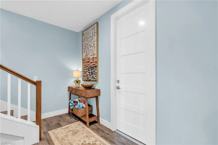 Entrance foyer featuring light wood-type flooring