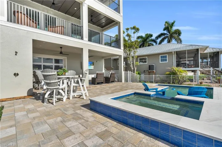 View of pool featuring an in ground hot tub, ceiling fan, and a patio