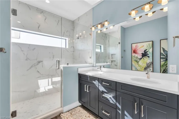 Bathroom with vanity and an enclosed shower