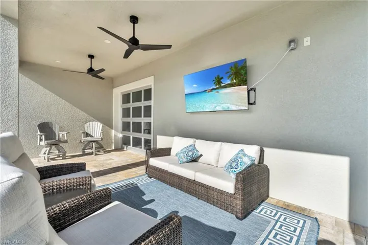 View of patio / terrace with an outdoor living space and ceiling fan