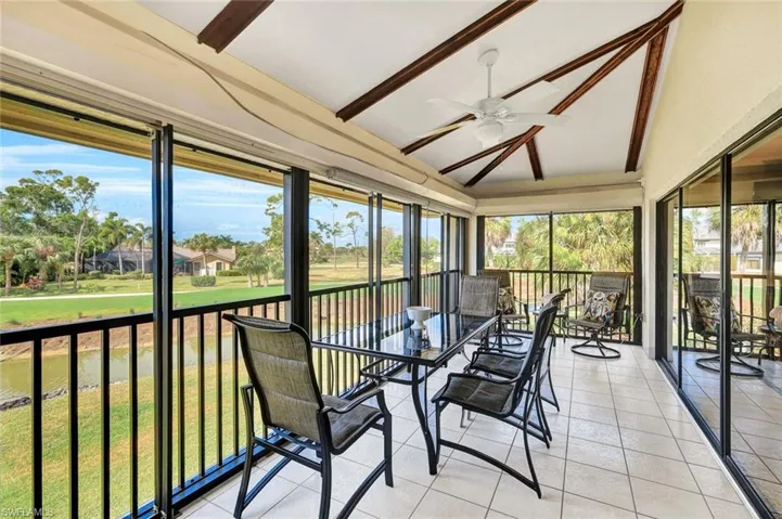 Tiled Screened Lanai with Electric Hurricane Shutters, Tile Flooring, Wood Beams