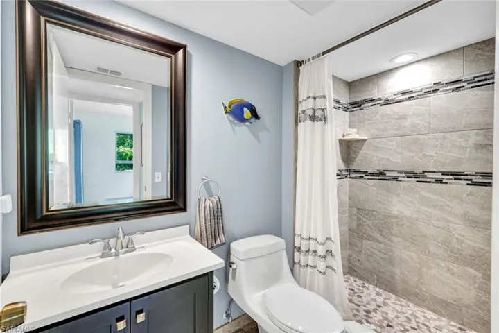 Full Guest Bath Complete with Step In Tiled Shower, Sinks, Toilets Cabinetry all New