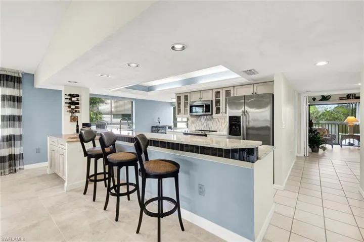 Glass Tile, LED Lighting, Lighted Tray Ceiling in The Kitchen