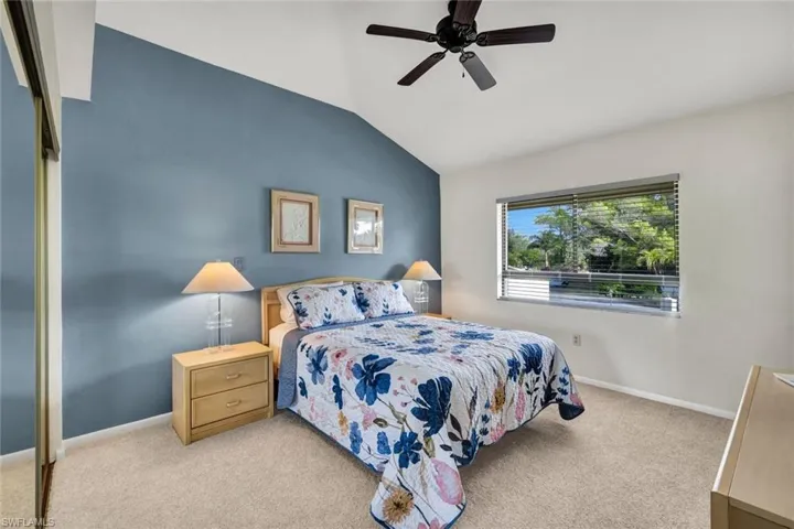 Large Newly Carpeted Guest Bedroom Shown with a Queen Bedroom Set- Double Door Closets