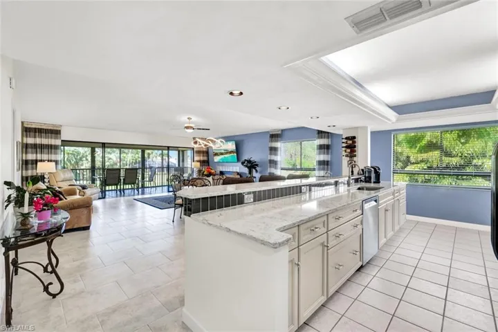 Great Room Concept with Open Air Remodeled Kitchen, Quartz, Glass Tiled Backsplash, Breakfast Bar