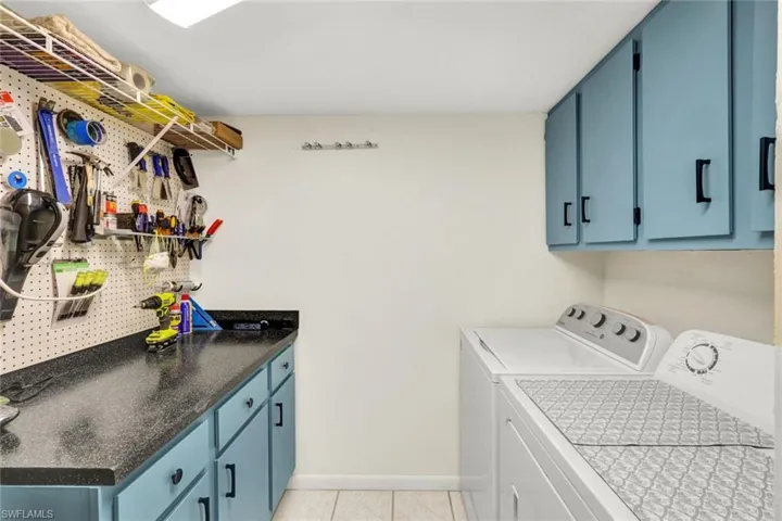 Fun Laundry Room Also Has A Work Bench Area, Full Size Washer and Dryer