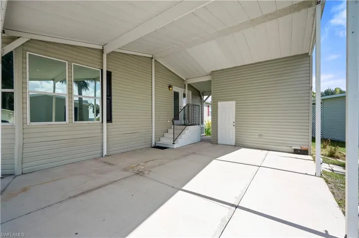View of patio / terrace with a carport