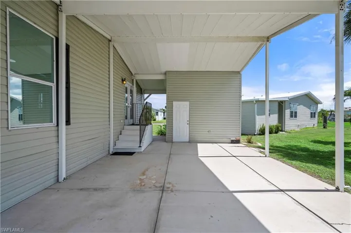 View of patio with an attached carport
