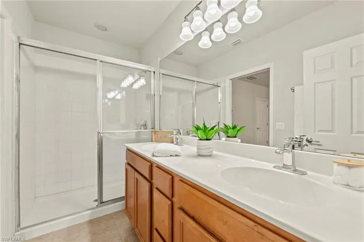 15021 Auk Way Bonita Springs FL 34135 - Primary bathroom with walk in shower and private commode