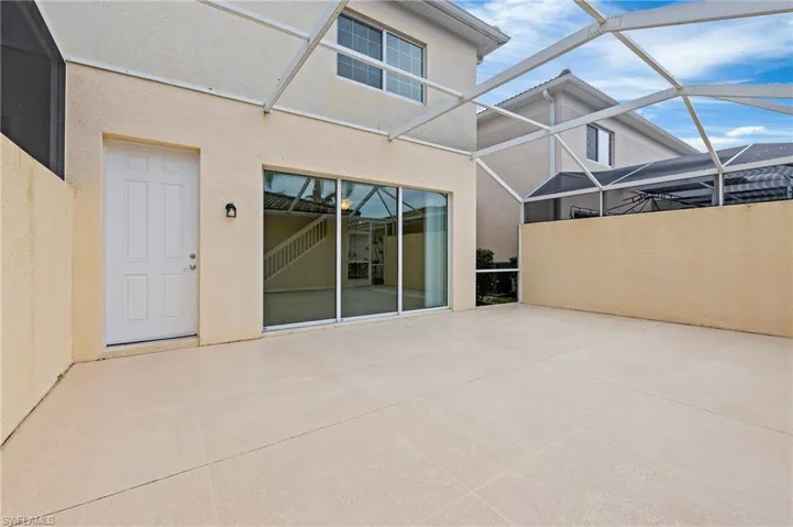 15021 Auk Way Bonita Springs FL 34135 - The screened patio creates a private courtyard outdoor space.
