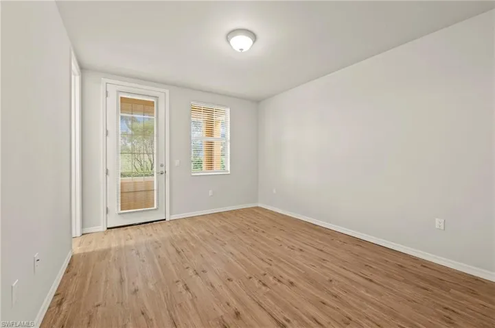 15021 Auk Way Bonita Springs FL 34135 - First floor bedroom with walk in closet and en suite bath and outside porch