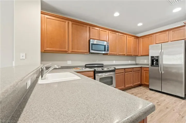 15021 Auk Way Bonita Springs FL 34135 - Eat at the bar in the kitchen or in the dining area.