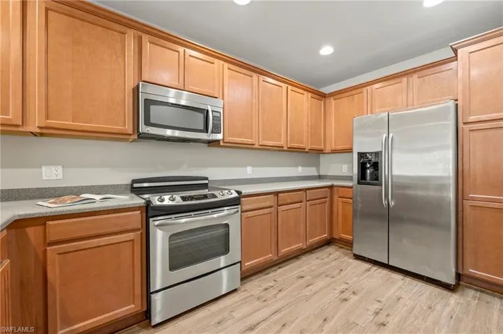 15021 Auk Way Bonita Springs FL 34135 - Kitchen with Corian countertops and stainless appliances.
